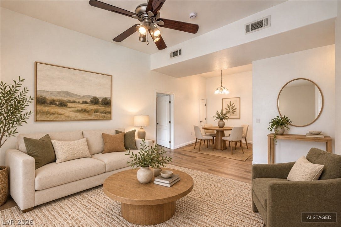 Crisp white walls and clean architectural lines define this welcoming, light-filled open interior.