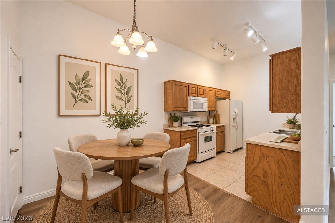 Warm wood cabinetry and durable tile flooring highlight this functional culinary space.