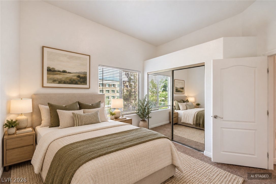 High ceilings and a mirrored closet maximize space in this comfortable bedroom layout.