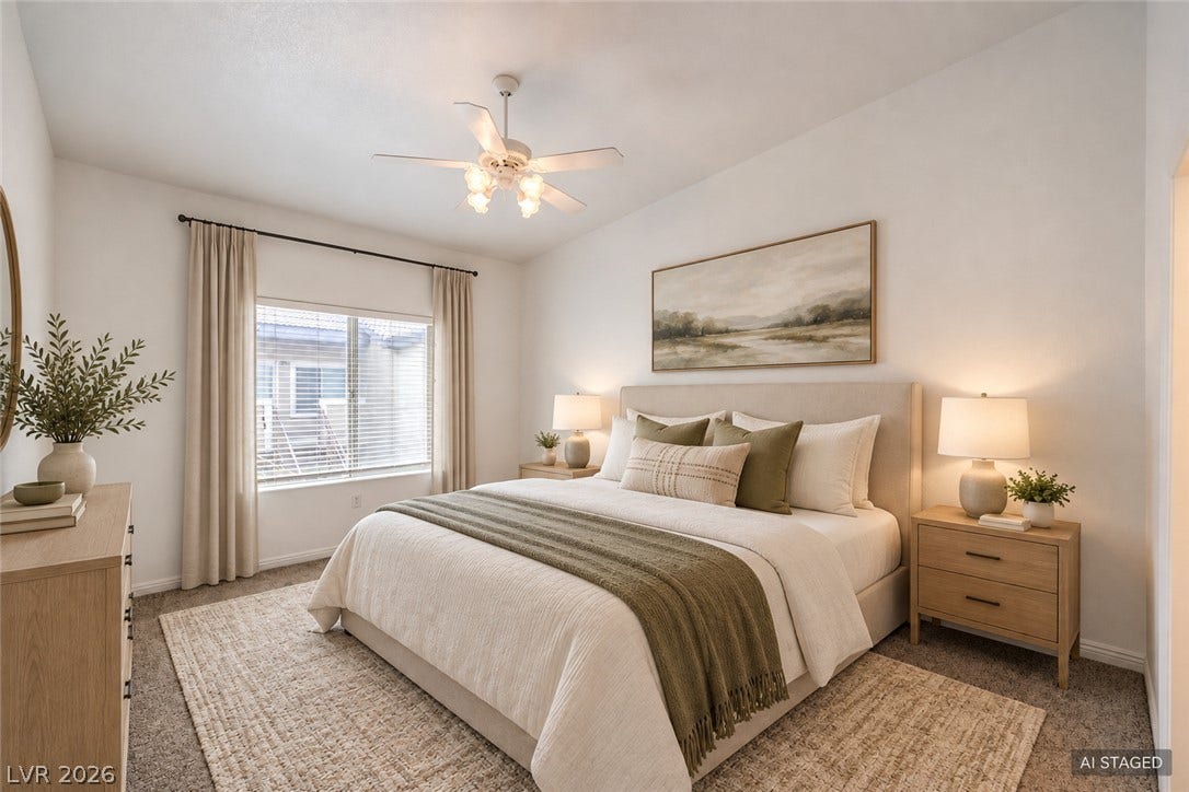 A spacious bedroom features soft carpeted flooring and a wide window overlooking the neighborhood.