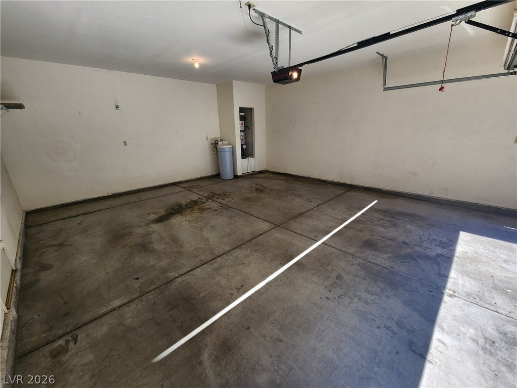 8301 Boseck Drive, #237, Las Vegas, NV 89145 An attached garage provides durable concrete flooring and direct utility connections.