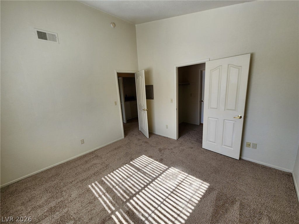 8301 Boseck Drive, #237, Las Vegas, NV 89145 High ceilings and soft carpeting define this comfortable private bedroom.