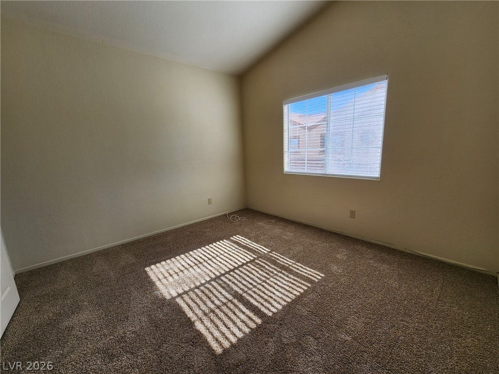 8301 Boseck Drive, #237, Las Vegas, NV 89145 High vaulted ceilings and comfortable carpeting define this versatile secondary bedroom space.