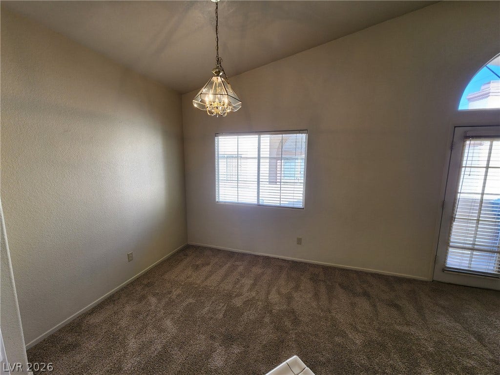 8301 Boseck Drive, #237, Las Vegas, NV 89145 Plush carpeting and vaulted ceilings enhance this versatile living space filled with natural light.