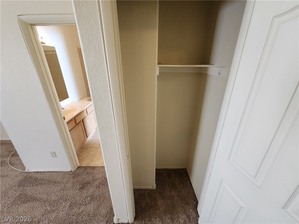 8301 Boseck Drive, #237, Las Vegas, NV 89145 Functional closet storage provides built-in shelving adjacent to the hallway bathroom.