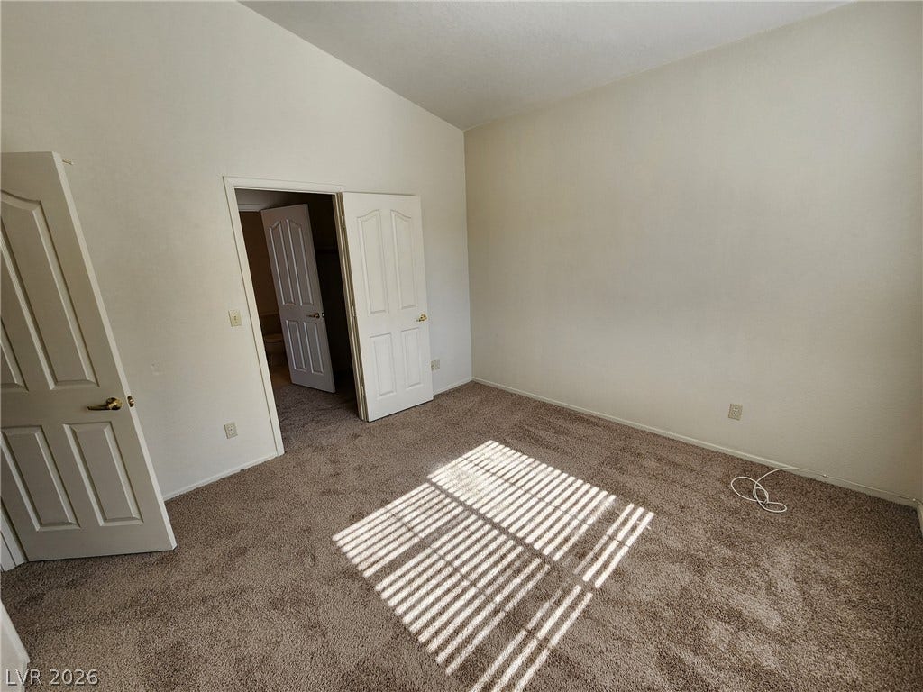 8301 Boseck Drive, #237, Las Vegas, NV 89145 Plush carpeting and vaulted ceilings enhance this comfortable bedroom layout.