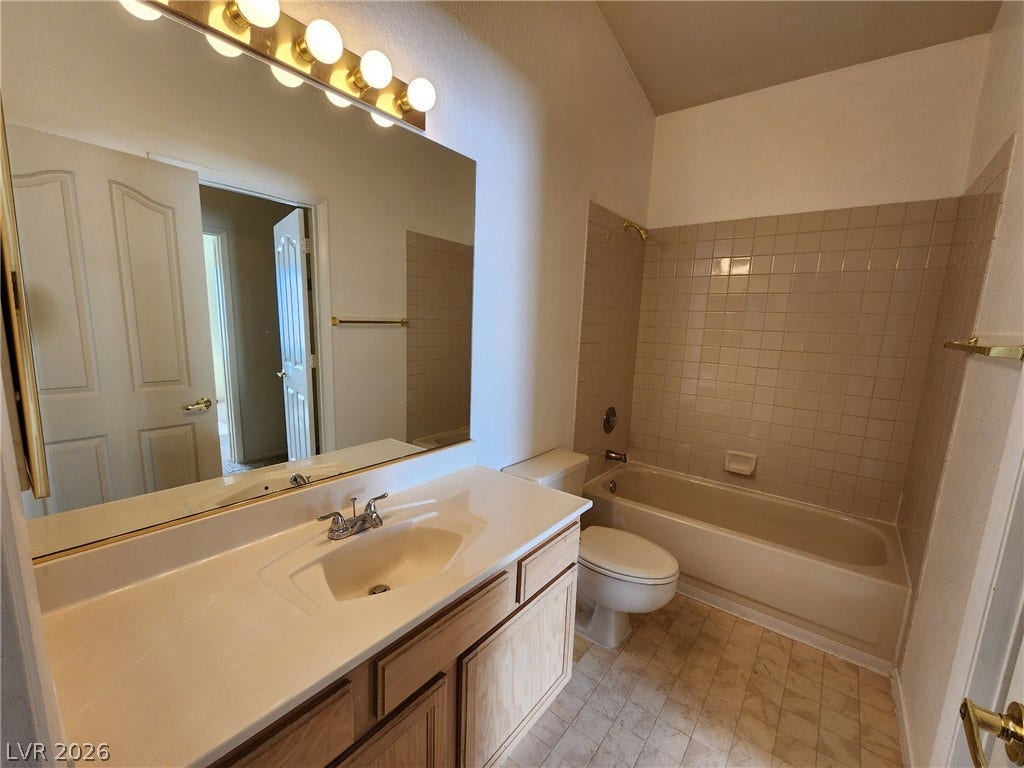 8301 Boseck Drive, #237, Las Vegas, NV 89145 High vaulted ceilings bring an airy, spacious feel to this classic bathroom design.