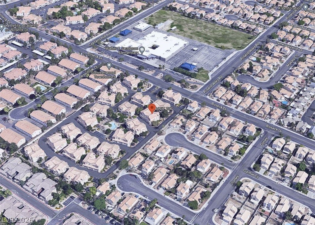 8301 Boseck Drive, #237, Las Vegas, NV 89145 An aerial perspective showcases the established neighborhood layout with surrounding streets and adjacent schools.