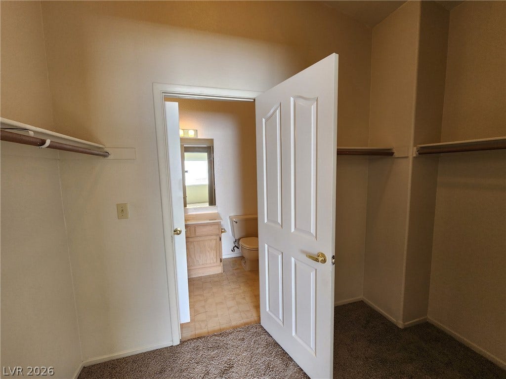 8301 Boseck Drive, #237, Las Vegas, NV 89145 A spacious closet with built-in hanging rods leads directly into the adjacent bathroom.