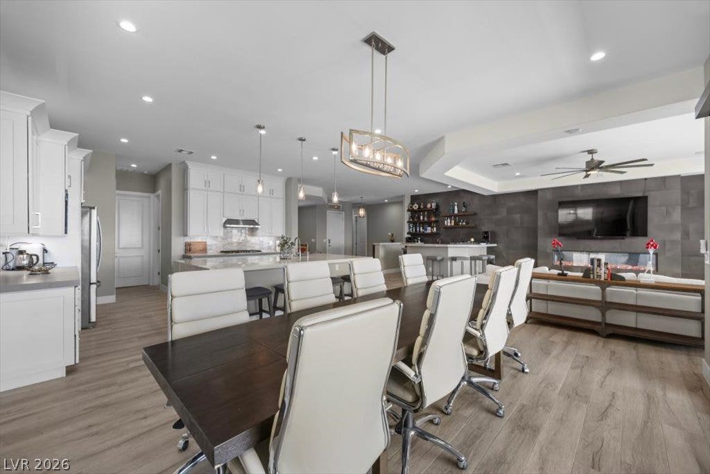 286 Besame Court, Las Vegas, NV 89138 An open floorplan seamlessly connects the dining area to a modern kitchen and living space.