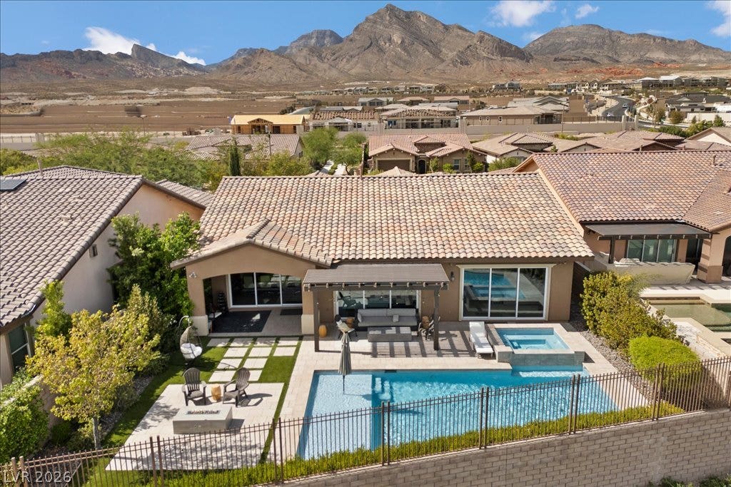 286 Besame Court, Las Vegas, NV 89138 Dramatic mountain peaks provide a majestic backdrop to this private backyard oasis.