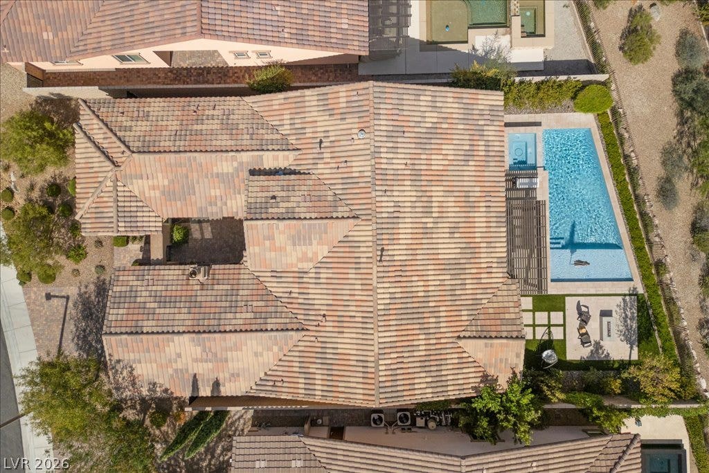 286 Besame Court, Las Vegas, NV 89138 An aerial view showcases the tile roof, private pool, and outdoor patio layout.