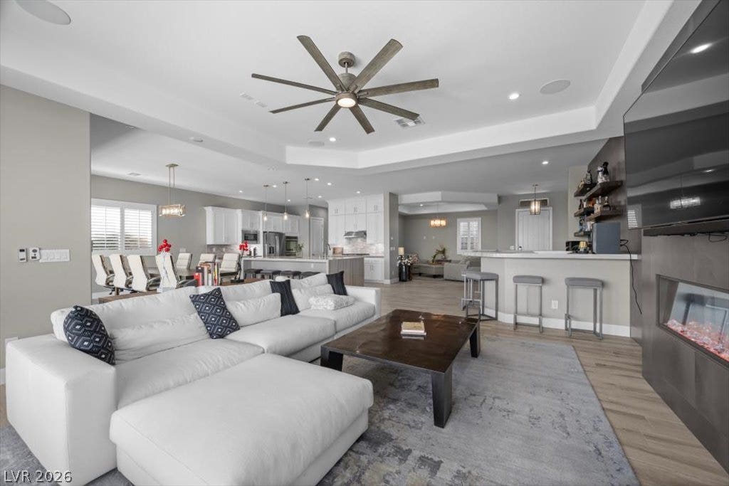286 Besame Court, Las Vegas, NV 89138 An open floor plan connects the living room to the kitchen and dining areas.