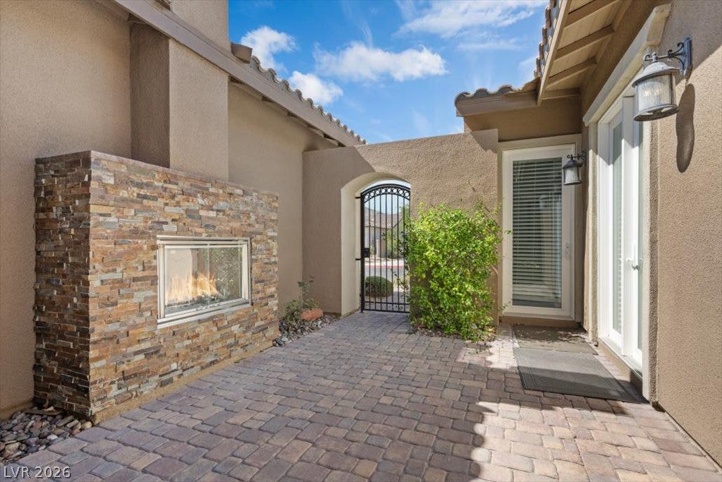 286 Besame Court, Las Vegas, NV 89138 Paved courtyard entry with security gate access.
Privet entry to Casita