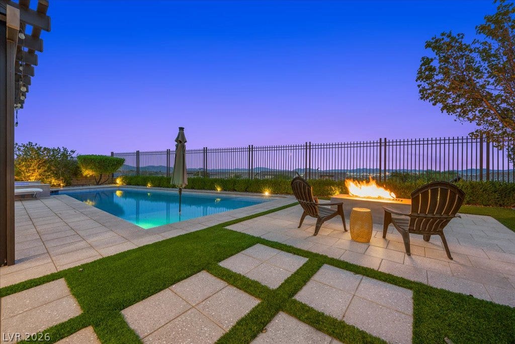 286 Besame Court, Las Vegas, NV 89138 An inviting stone patio surrounds the sparkling swimming pool and modern fire pit.