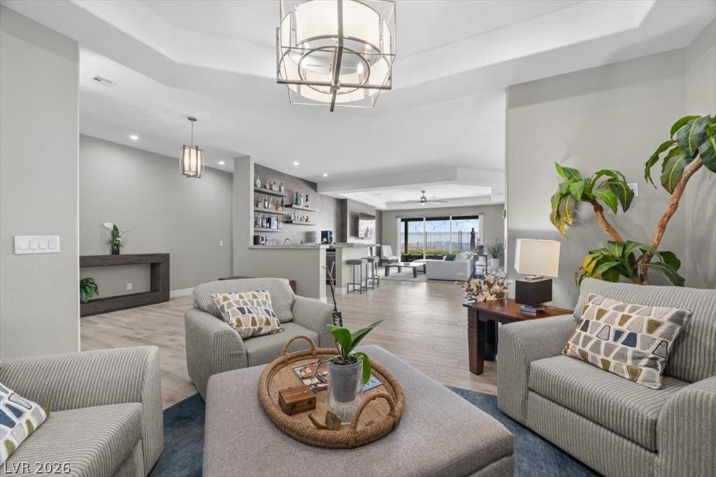 286 Besame Court, Las Vegas, NV 89138 An open floor plan connects the comfortable living spaces with a built-in bar.