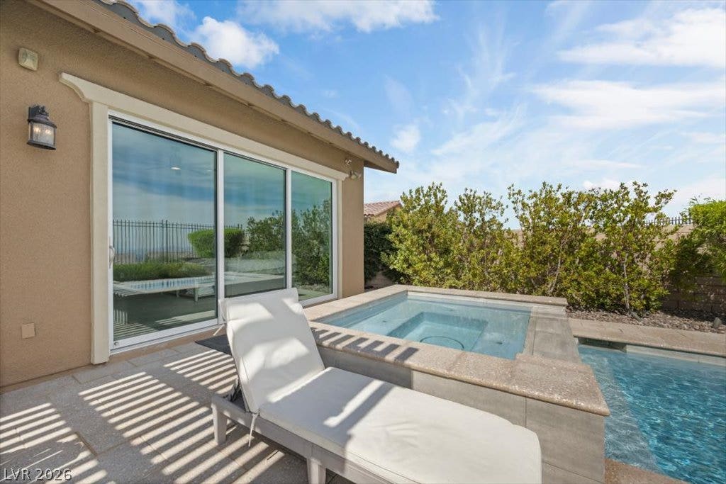 286 Besame Court, Las Vegas, NV 89138 An inviting pool and elevated spa rest just outside the glass sliding doors.