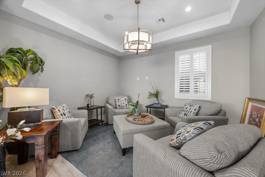 286 Besame Court, Las Vegas, NV 89138 Elegant tray ceilings and timeless plantation shutters define this welcoming living space.