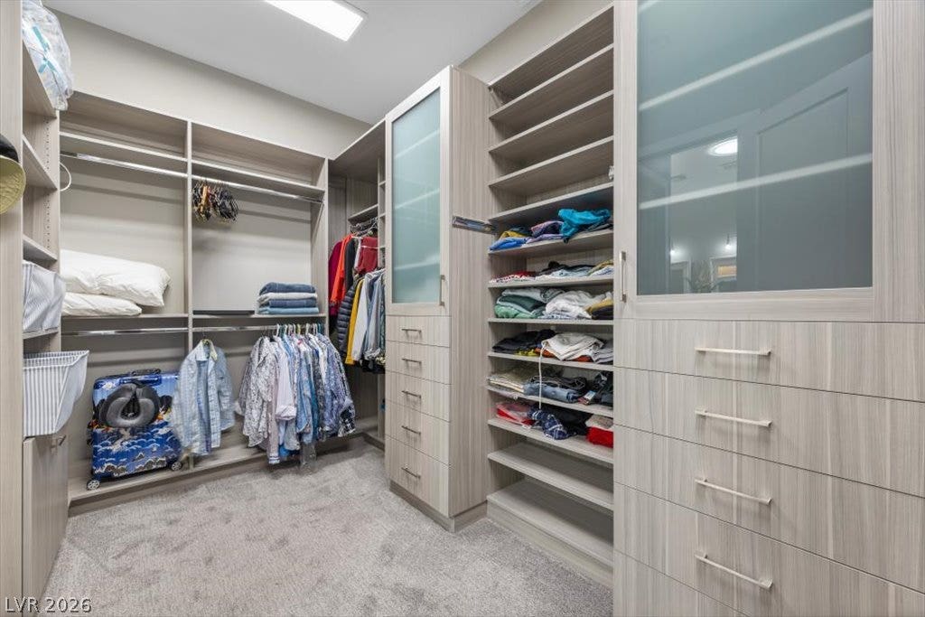286 Besame Court, Las Vegas, NV 89138 Custom built-in cabinetry provides extensive organization and storage options in this spacious walk-in closet.