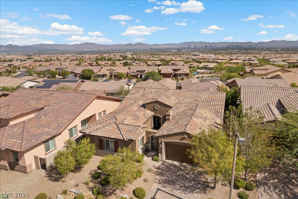 286 Besame Court, Las Vegas, NV 89138 Stately tile roofing and native landscaping define this desert neighborhood residence.