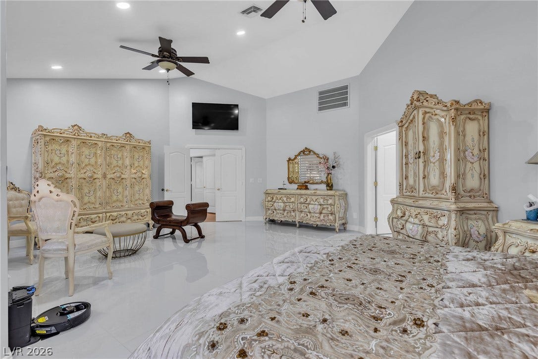 3341 Camino Gardens Way, Las Vegas, NV 89146 High vaulted ceilings and polished tile floors define this sprawling primary suite.
