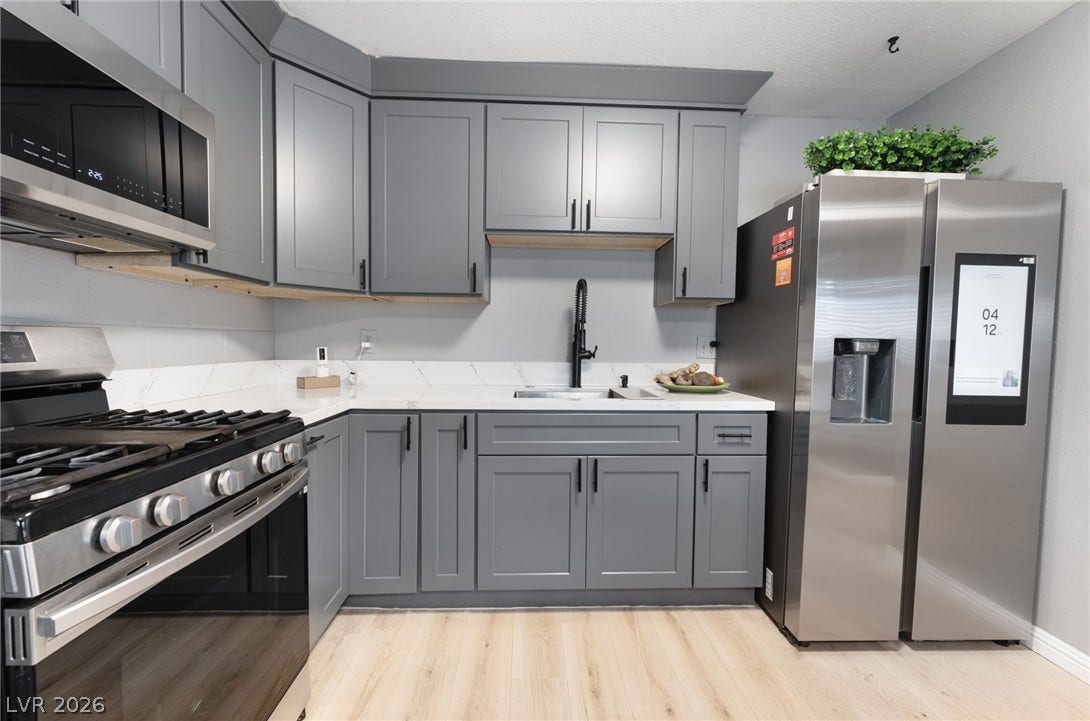 2515 Donna Street, #C, North Las Vegas, NV 89030 Elegant stone countertops and modern cabinetry highlight this efficiently designed culinary space.