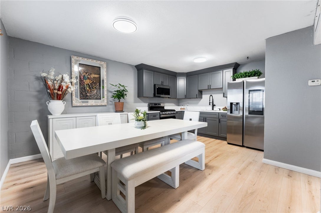 2515 Donna Street, #C, North Las Vegas, NV 89030 An open dining area flows seamlessly into a modernized kitchen with wood flooring.