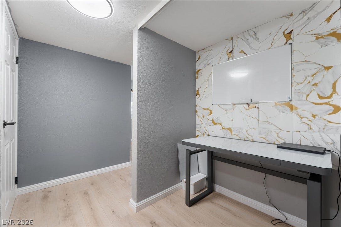 2515 Donna Street, #C, North Las Vegas, NV 89030 Smooth wood-look flooring and clean drywall finishes define this functional home work space.