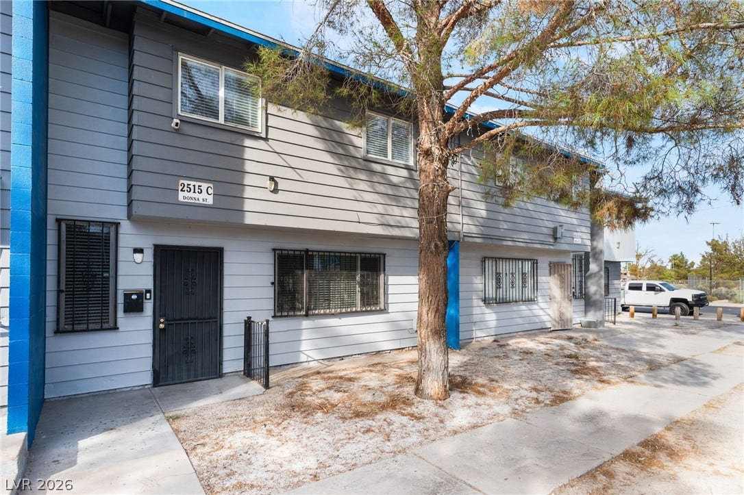 2515 Donna Street, #C, North Las Vegas, NV 89030 Mature trees shade the exterior of this two-story residential building with private entryways.