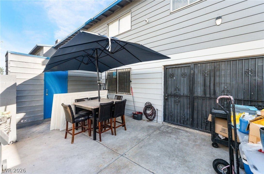 2515 Donna Street, #C, North Las Vegas, NV 89030 Concrete patio surfaces provide low-maintenance space adjacent to the horizontal siding exterior.