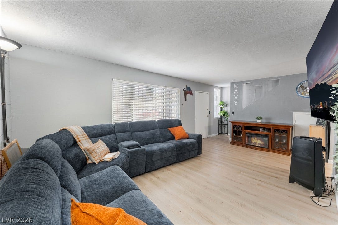2515 Donna Street, #C, North Las Vegas, NV 89030 Smooth wood flooring flows throughout this welcoming living area under a clean ceiling design.