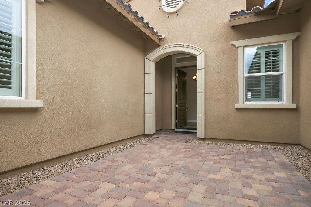 286 Lindura Court, Las Vegas, NV 89138 A welcoming stone-paved courtyard entry leads to the arched front door of this elegant residence.