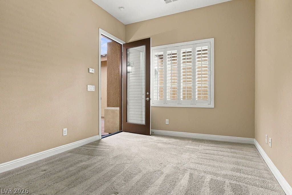 286 Lindura Court, Las Vegas, NV 89138 Plush carpeting and classic plantation shutters define this versatile space, opening to a private outdoor area.