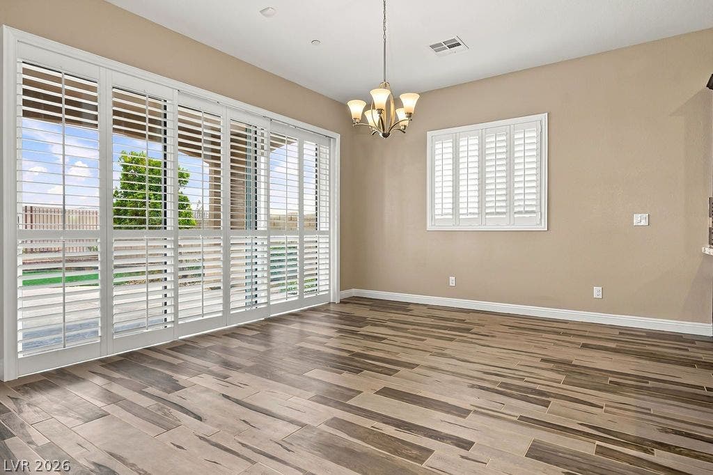 286 Lindura Court, Las Vegas, NV 89138 Gleaming plank flooring and plantation shutters define this bright dining space.