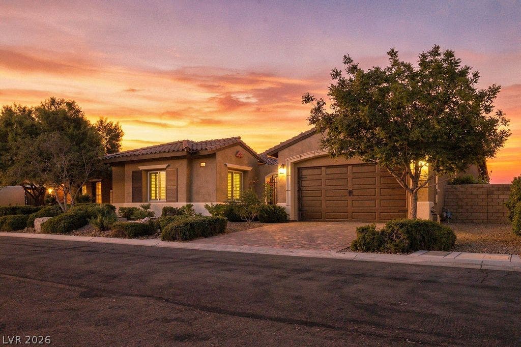 286 Lindura Court, Las Vegas, NV 89138 Stately stucco architecture and a paved driveway anchor this elegant single-level desert home.