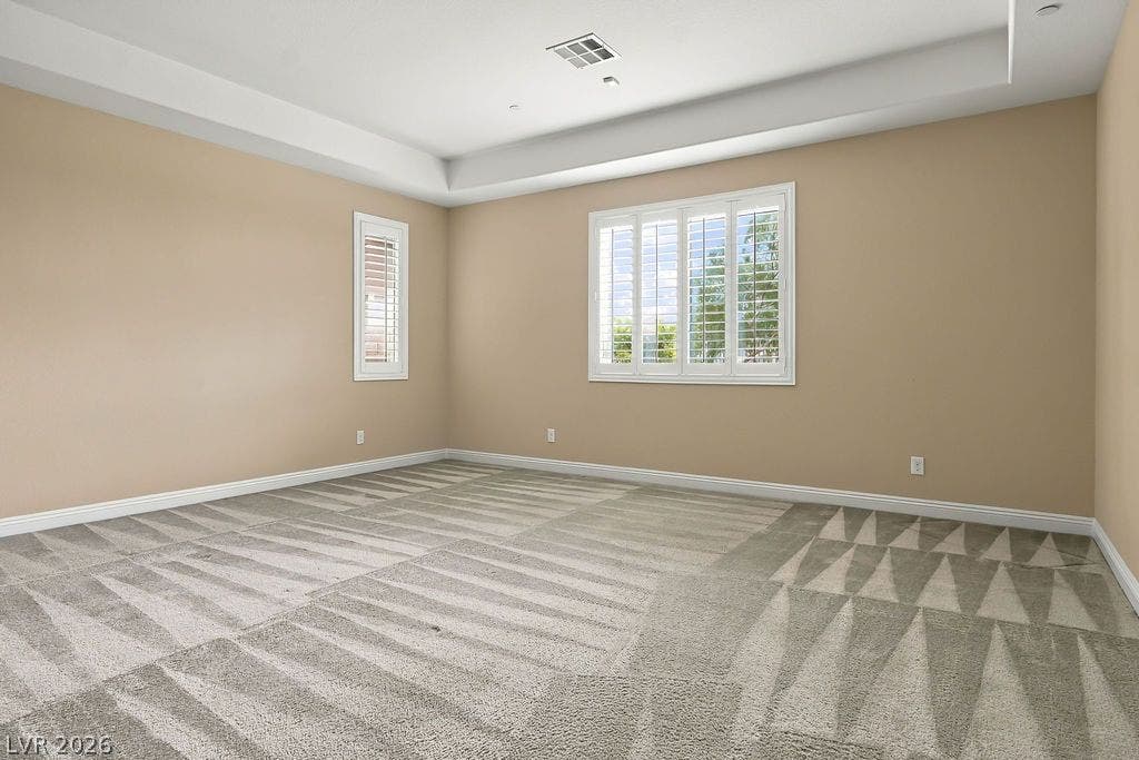 286 Lindura Court, Las Vegas, NV 89138 Plush carpeting and plantation shutters define this versatile room topped by a tray ceiling.