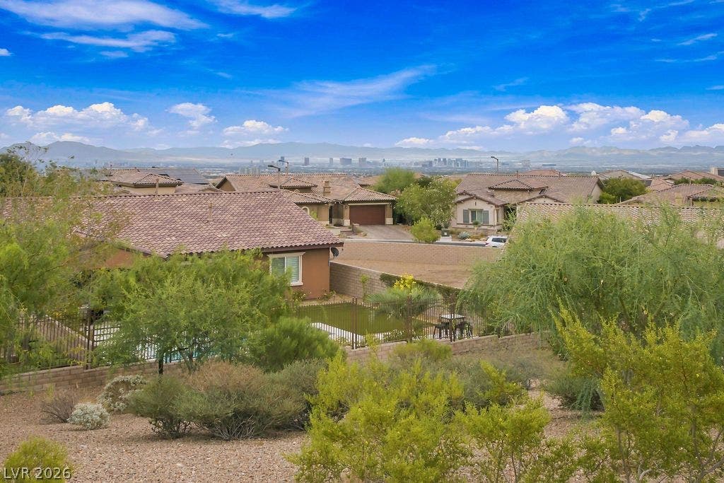 286 Lindura Court, Las Vegas, NV 89138 Distant skyline vistas stretch across the horizon beyond the surrounding desert neighborhood.