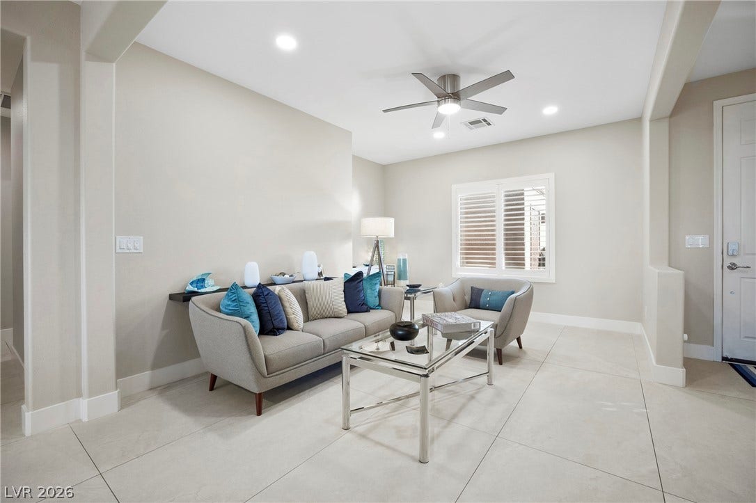 2432 Anderson Park Drive, Henderson, NV 89044 Tiled flooring and recessed lighting define this inviting, open-concept living space.