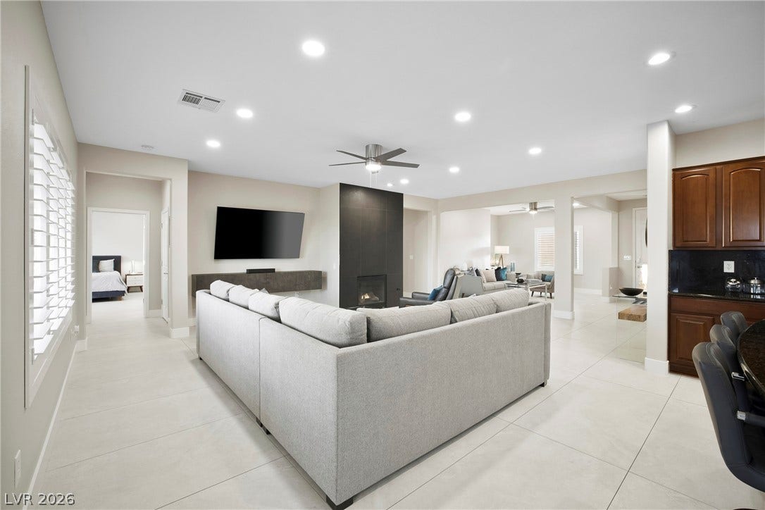 2432 Anderson Park Drive, Henderson, NV 89044 Gleaming tile floors and recessed lighting enhance this airy, modern living space.