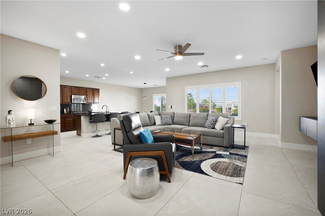 2432 Anderson Park Drive, Henderson, NV 89044 An open floorplan seamlessly connects the airy living area to the adjacent kitchen space.