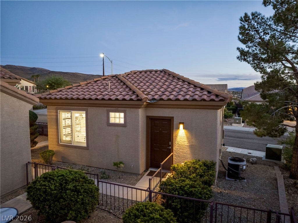 2432 Anderson Park Drive, Henderson, NV 89044 Spanish tile roofing and textured stucco walls define this charming detached casita entryway.
