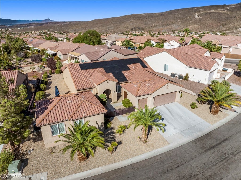 2432 Anderson Park Drive, Henderson, NV 89044 Desert-inspired landscaping and rooftop solar panels define this single-story neighborhood home.