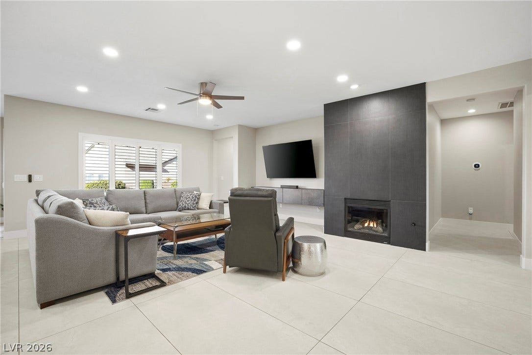 2432 Anderson Park Drive, Henderson, NV 89044 An elegant tile fireplace serves as the centerpiece of this contemporary living space.