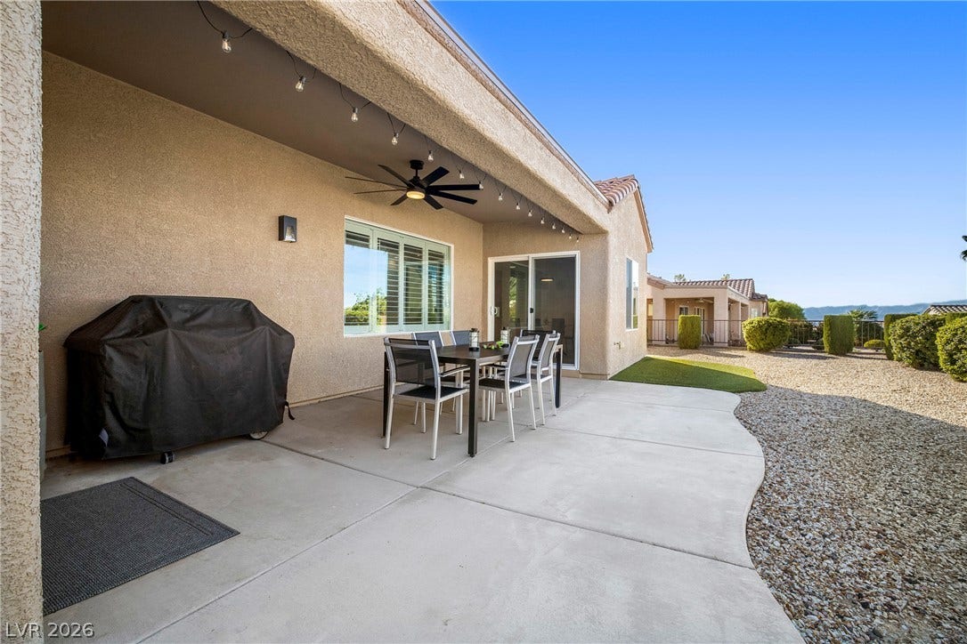 2432 Anderson Park Drive, Henderson, NV 89044 An inviting covered concrete patio transitions smoothly to the gravel-scaped yard beyond.