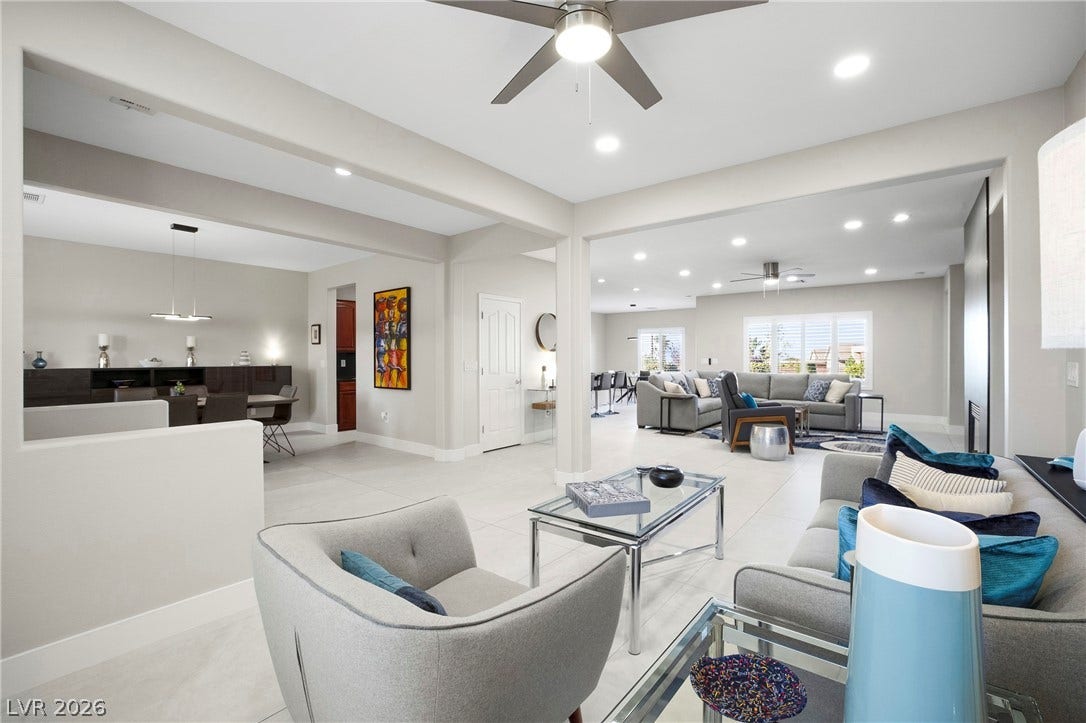 2432 Anderson Park Drive, Henderson, NV 89044 An open floorplan seamlessly connects multiple living spaces characterized by tile flooring and recessed lighting.