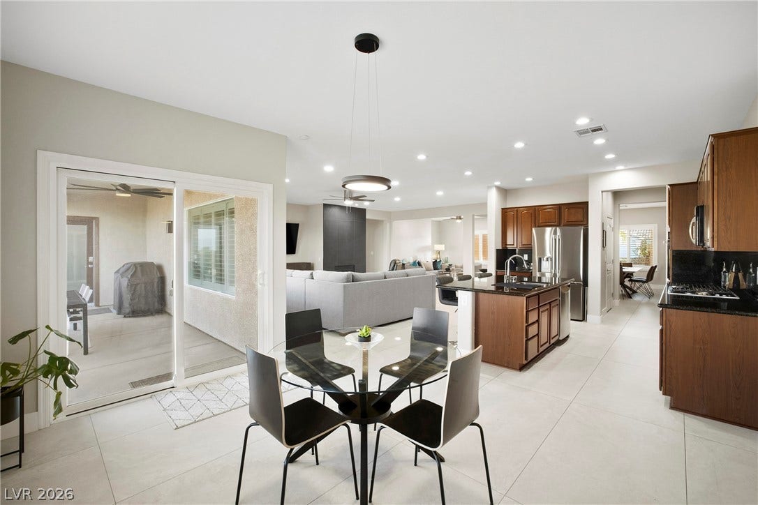 2432 Anderson Park Drive, Henderson, NV 89044 Gleaming tile floors and sliding glass doors enhance this open dining and kitchen area.