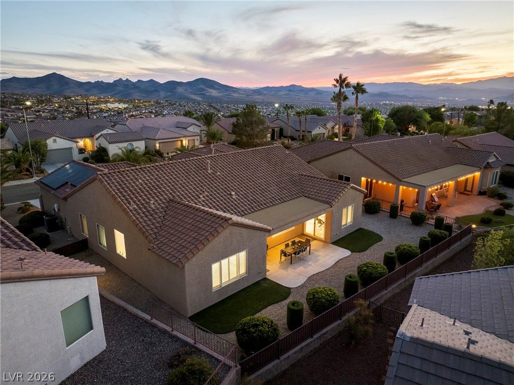2432 Anderson Park Drive, Henderson, NV 89044 Dramatic mountain and valley views frame this beautifully situated single-story home at sunset.