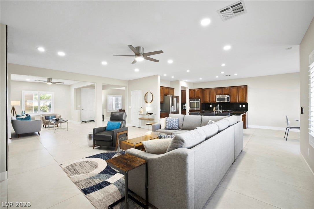 2432 Anderson Park Drive, Henderson, NV 89044 Gleaming tile floors flow seamlessly through this expansive open-concept living area.