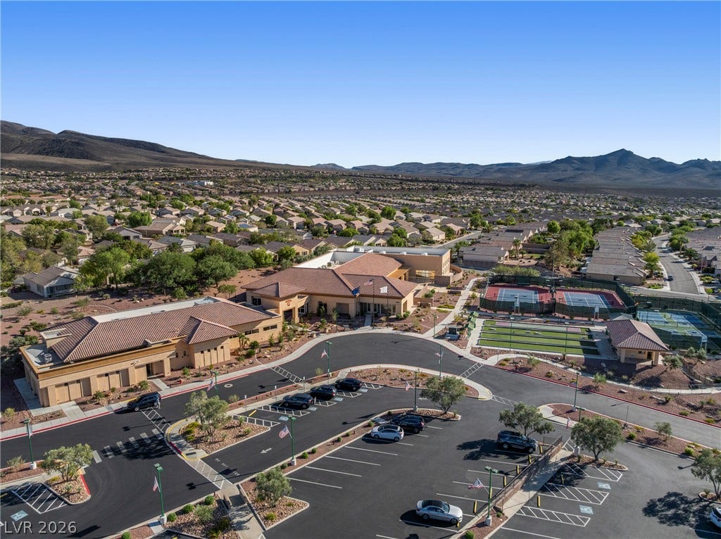 2432 Anderson Park Drive, Henderson, NV 89044 A spacious community center complex nestles within a desert landscape featuring majestic mountain backdrops.