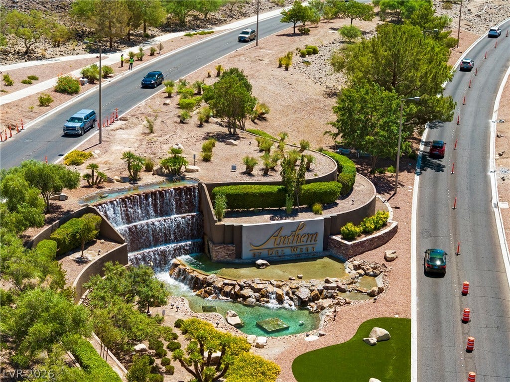 2432 Anderson Park Drive, Henderson, NV 89044 A grand multi-tiered waterfall sign structure welcomes residents at the landscaped community entrance.